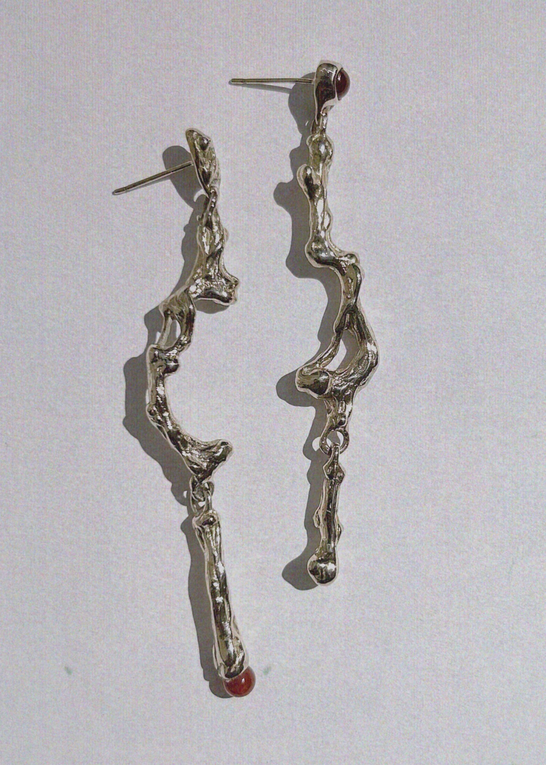 sculptural long mismatched earrings with natural gemstones
