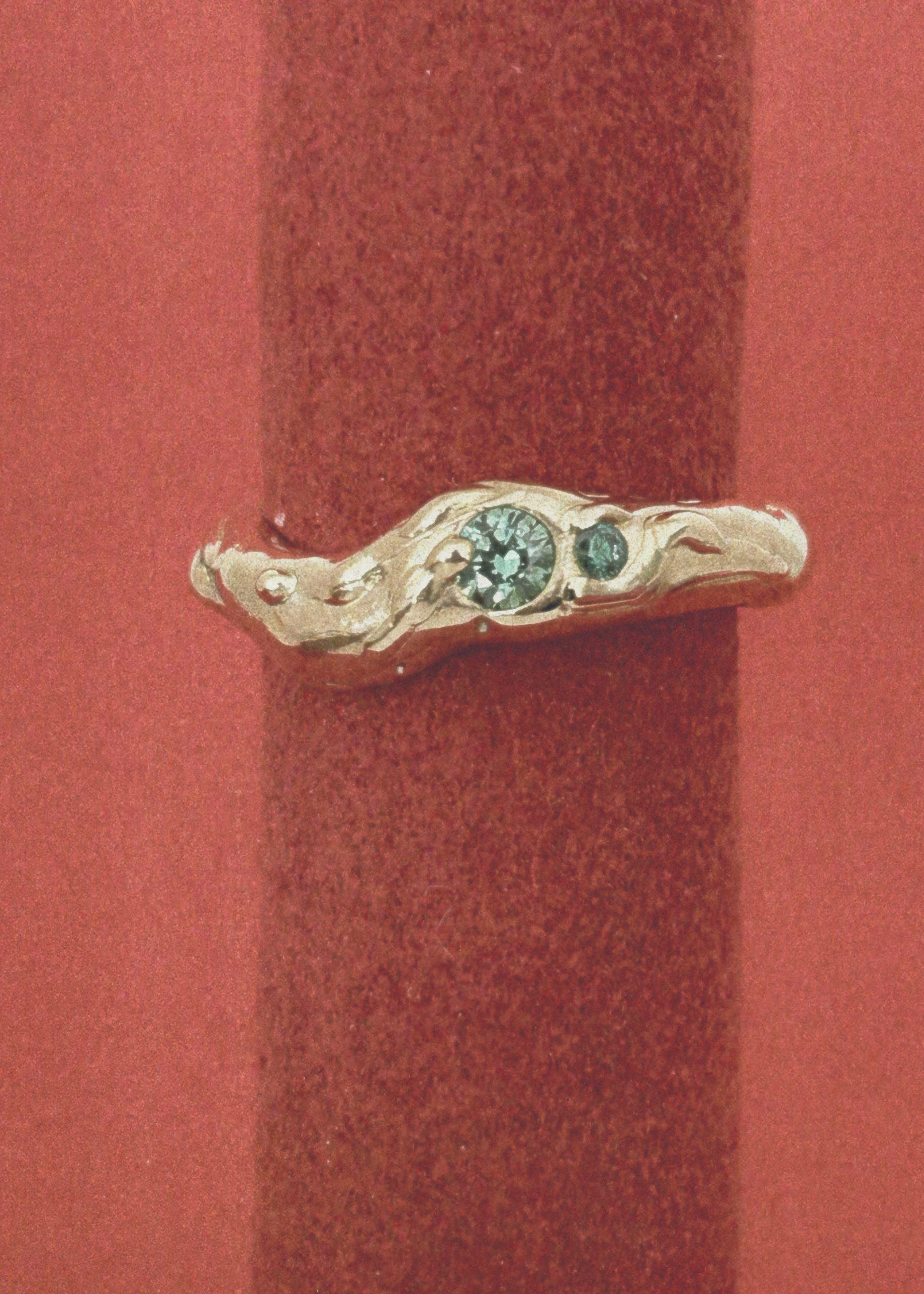 one of a kind ring with green lab grown gems