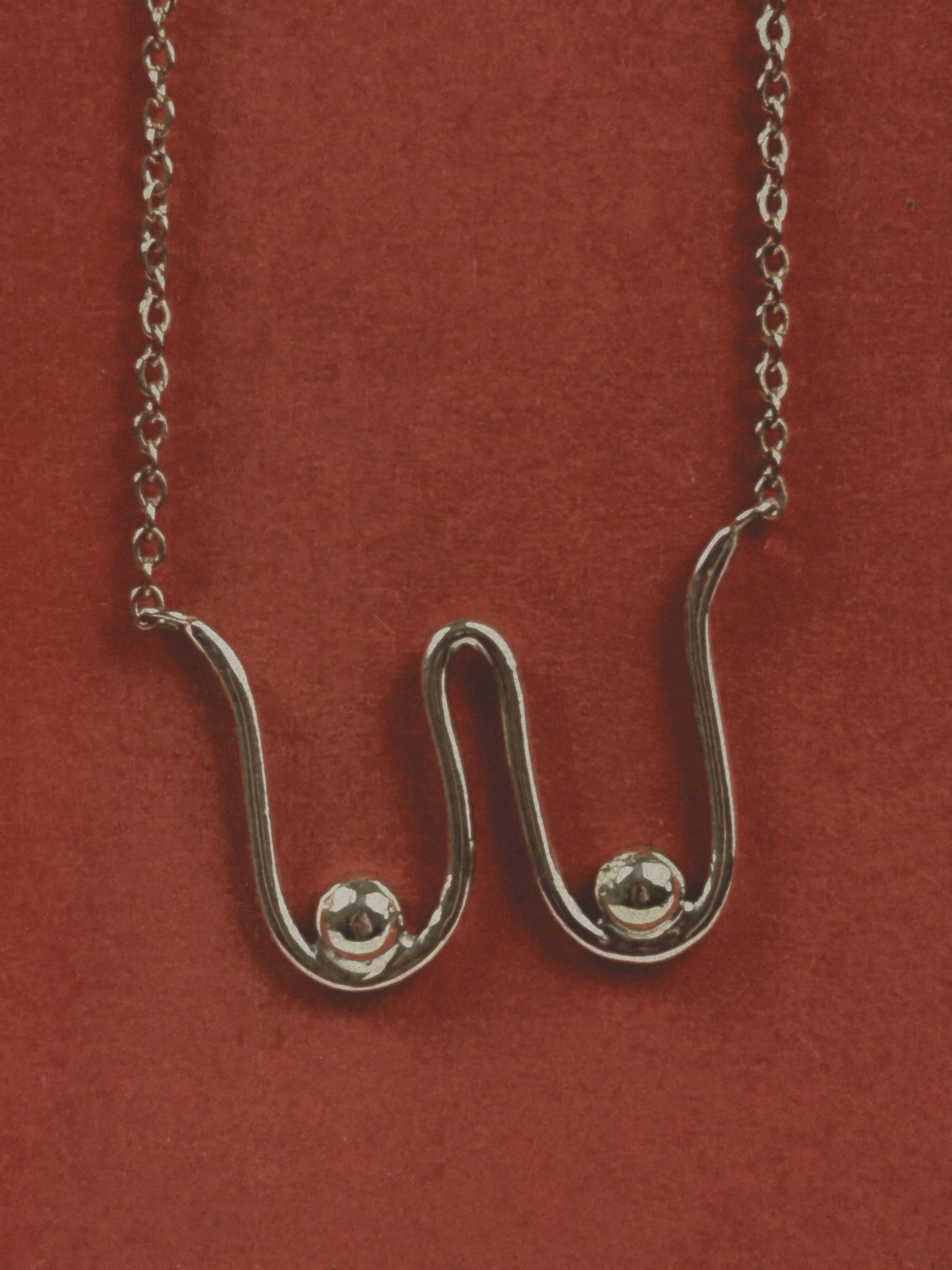 handmade minimalist necklace inspired by abstract feminine shapes