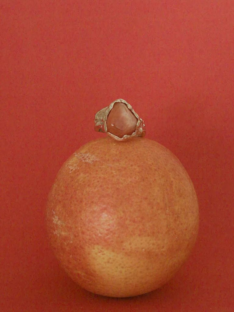 Organic sculptural jewellery arranged in an editorial object composition