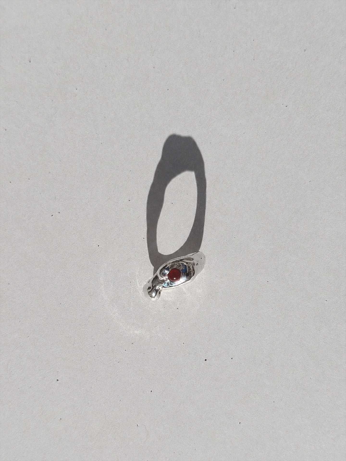 sculptural silver ring with carnelian